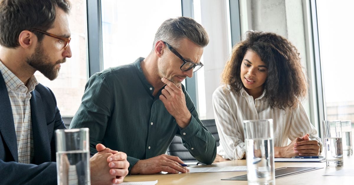 Man thinking over a document