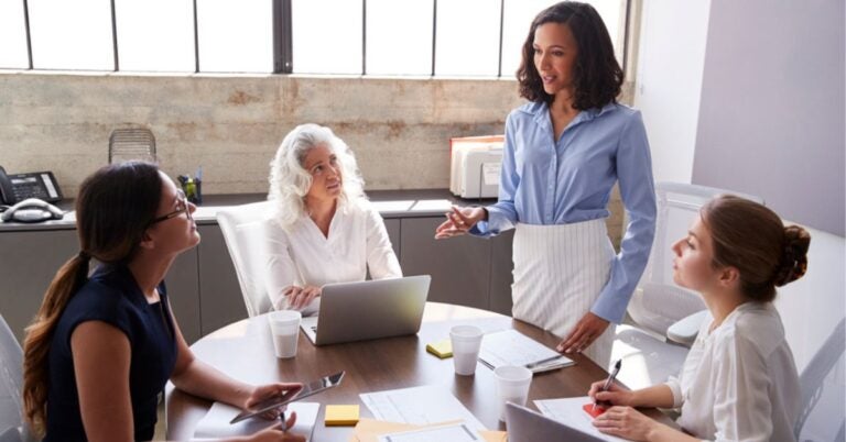 Woman talking to a small group