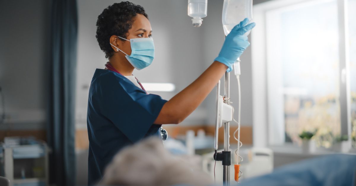 Medical professional checking an intravenous bag