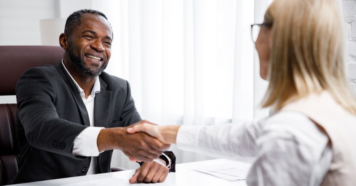 Man and woman shaking hands