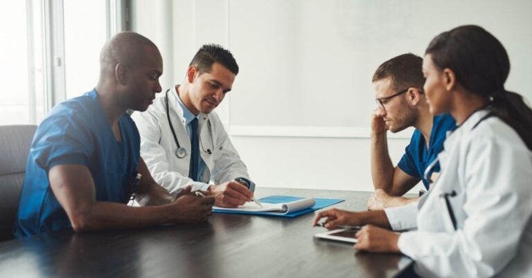 Medical professionals gathered around a table