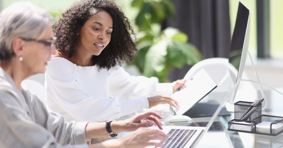 Woman typing information into a computer