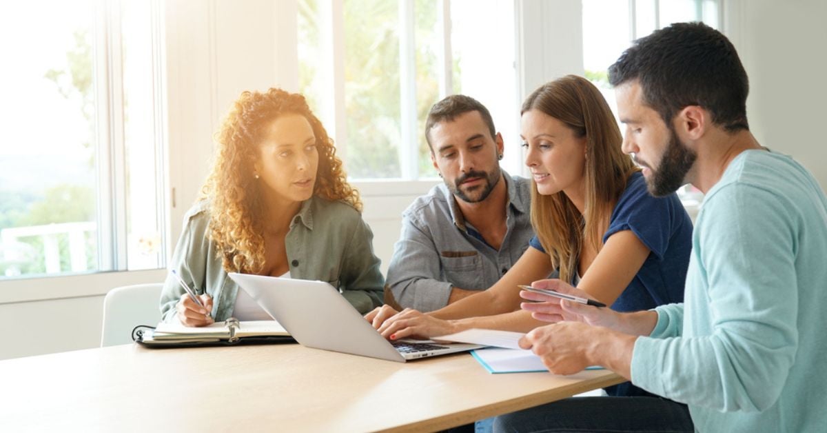 Woman showing a report to a group