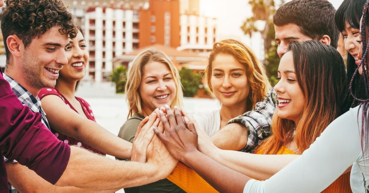 Group of people all giving a high five