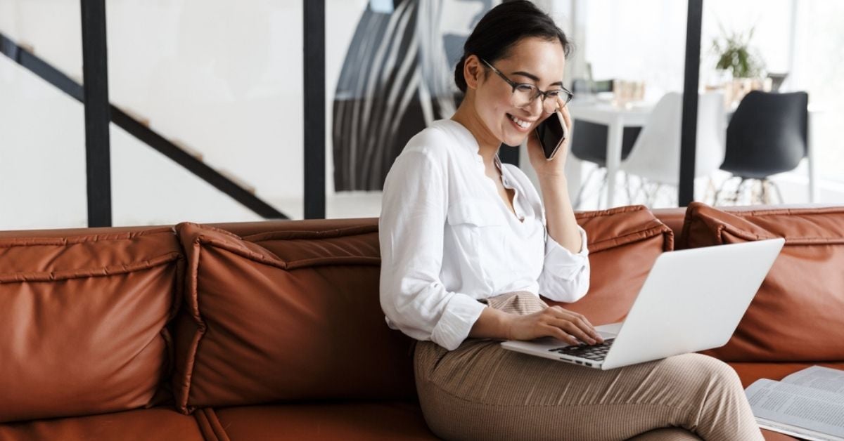 Woman with a laptop talking on the phone