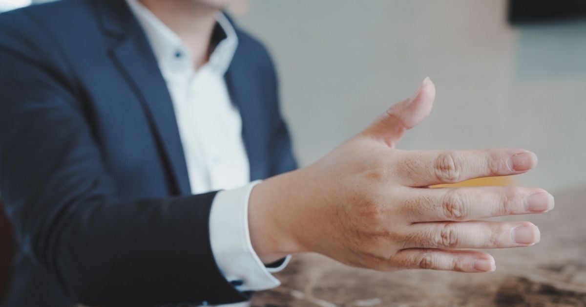 Person stretching out their hand