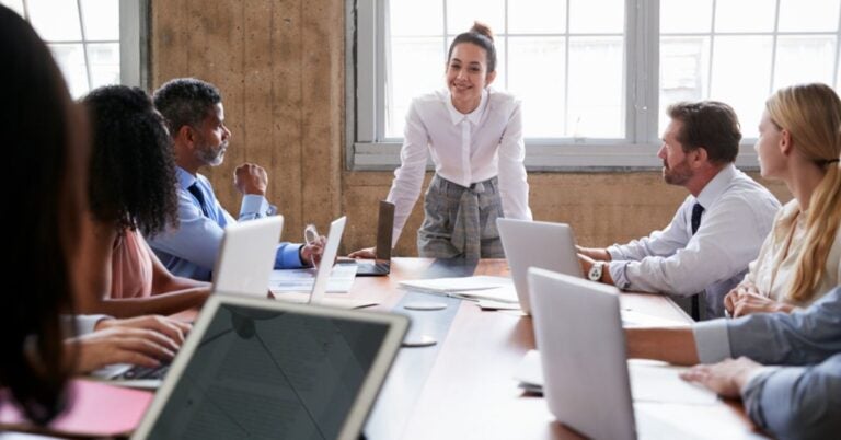 Woman giving a presentation to group