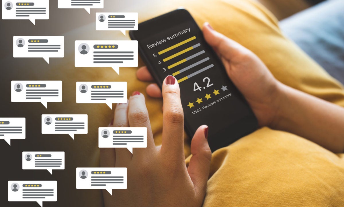 Woman Reading Consumer Reviews on a Smartphone