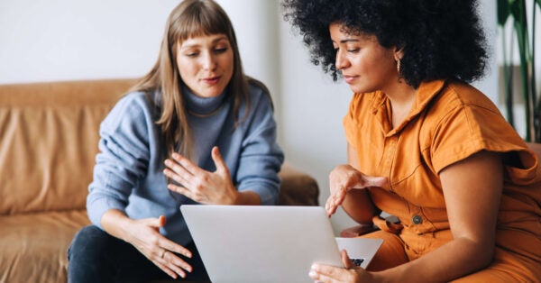 coworkers chat on couch