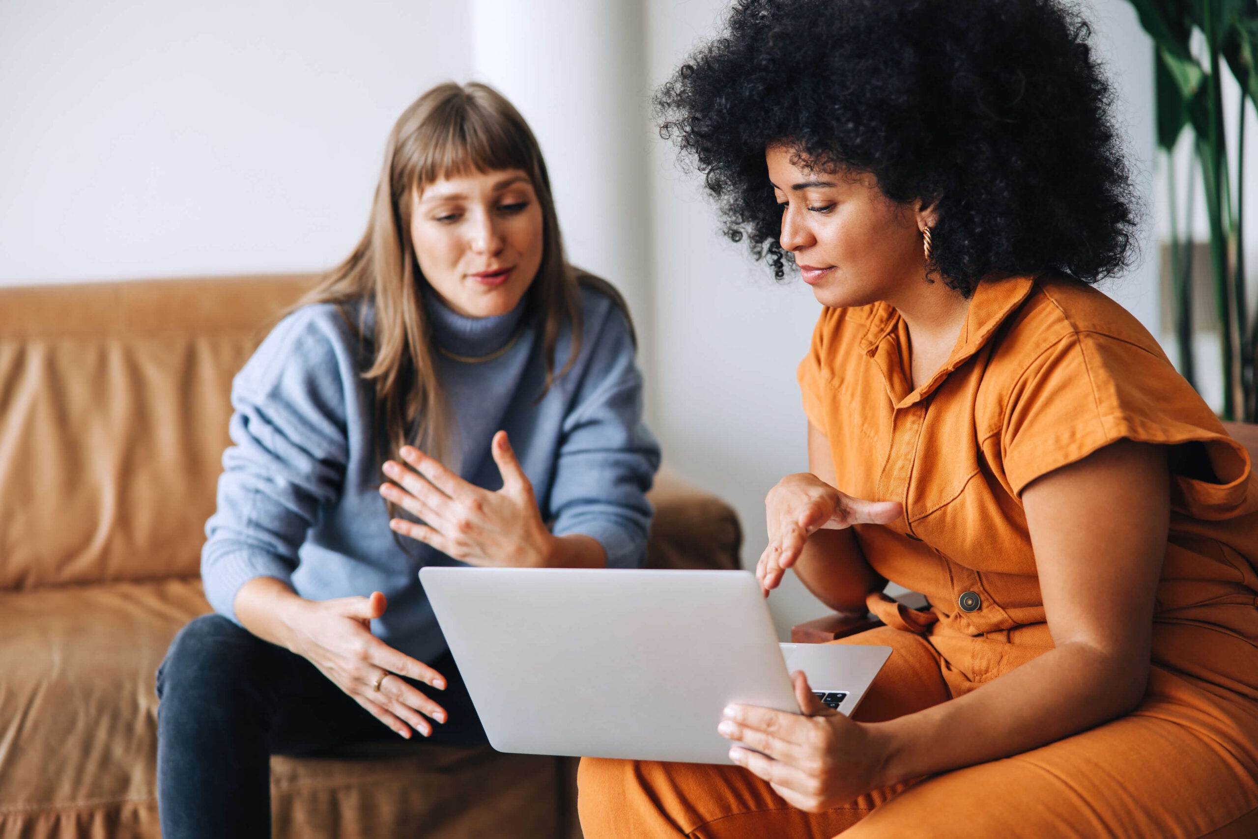 coworkers chat on couch