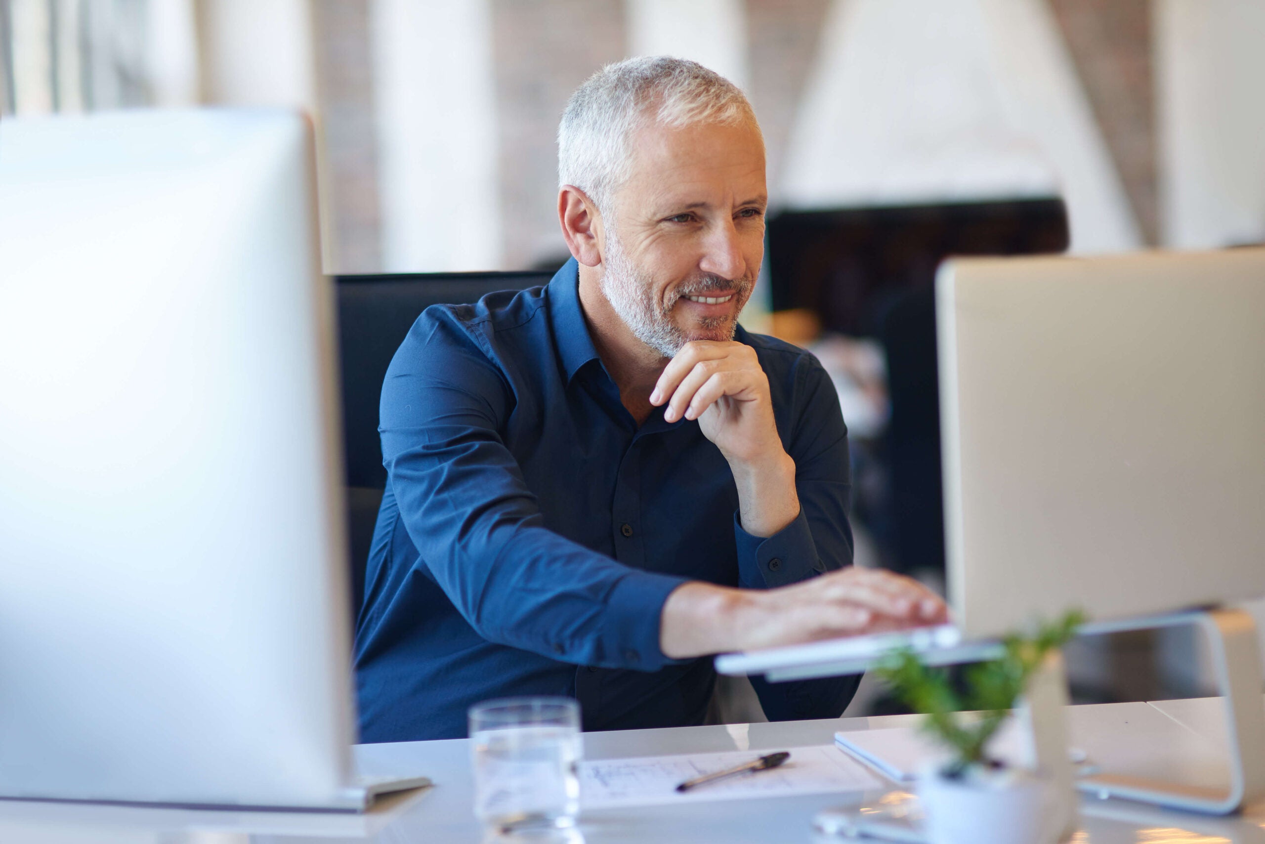 businessman works on computer