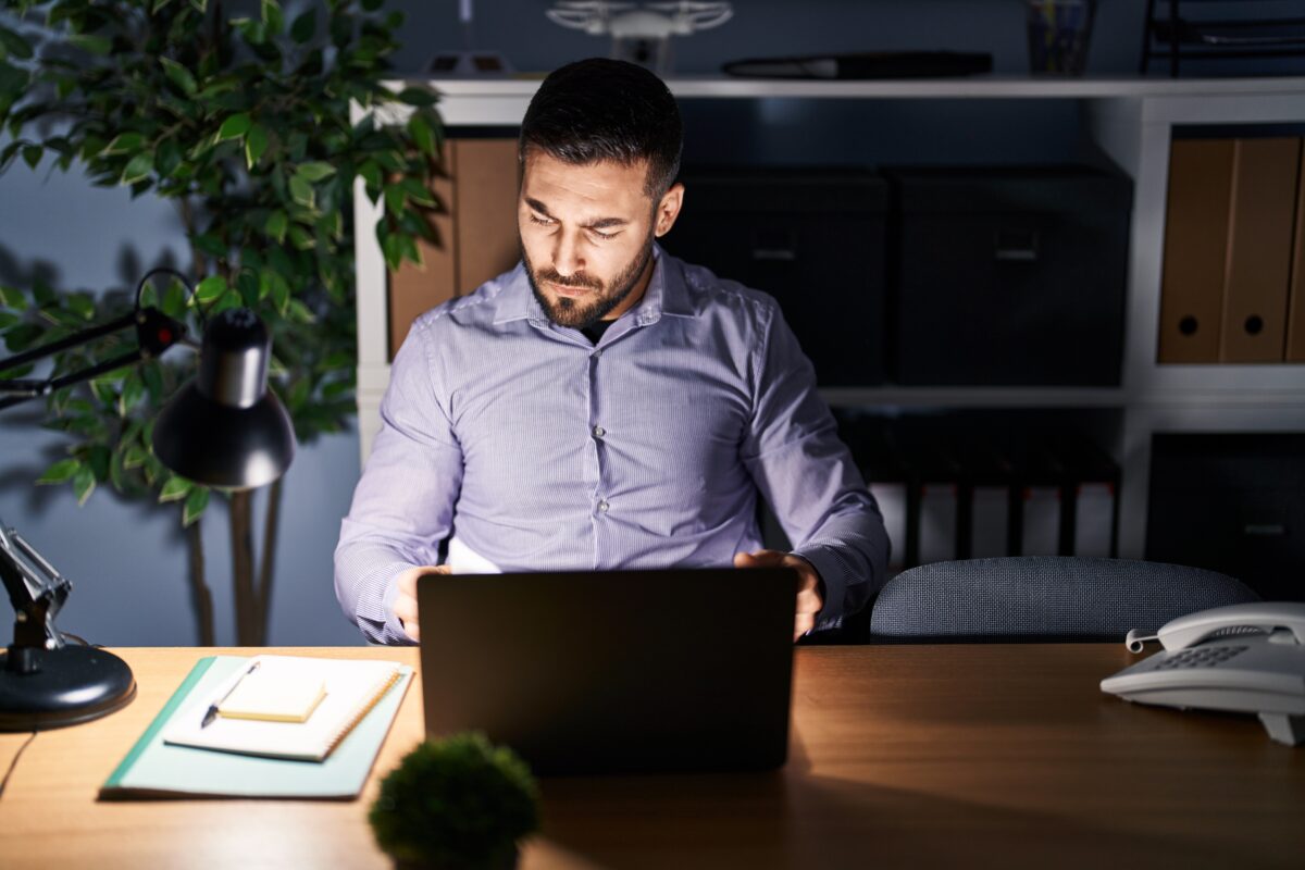 Businessman working late at night on computer