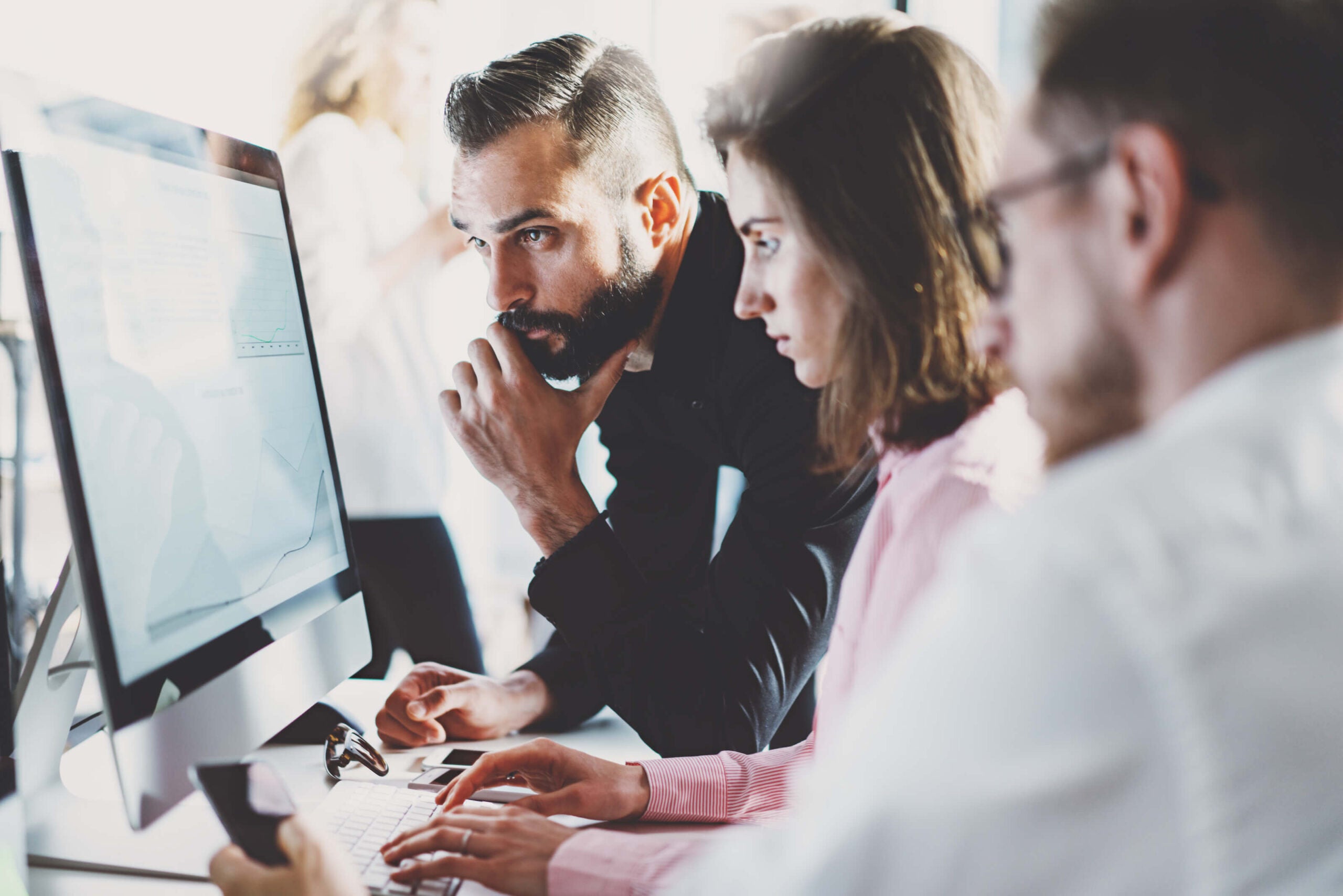 professionals looking at computer