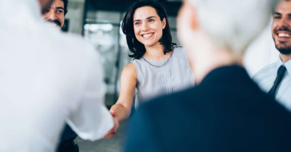 corporate job candidate meets interview team