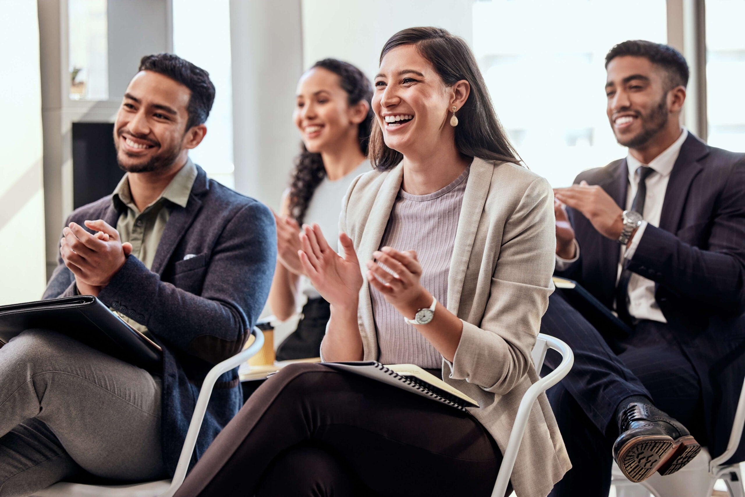 group of employees clapping celebrate