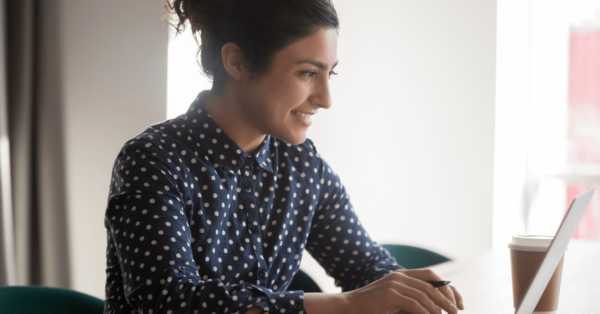 young businessperson smiles while working