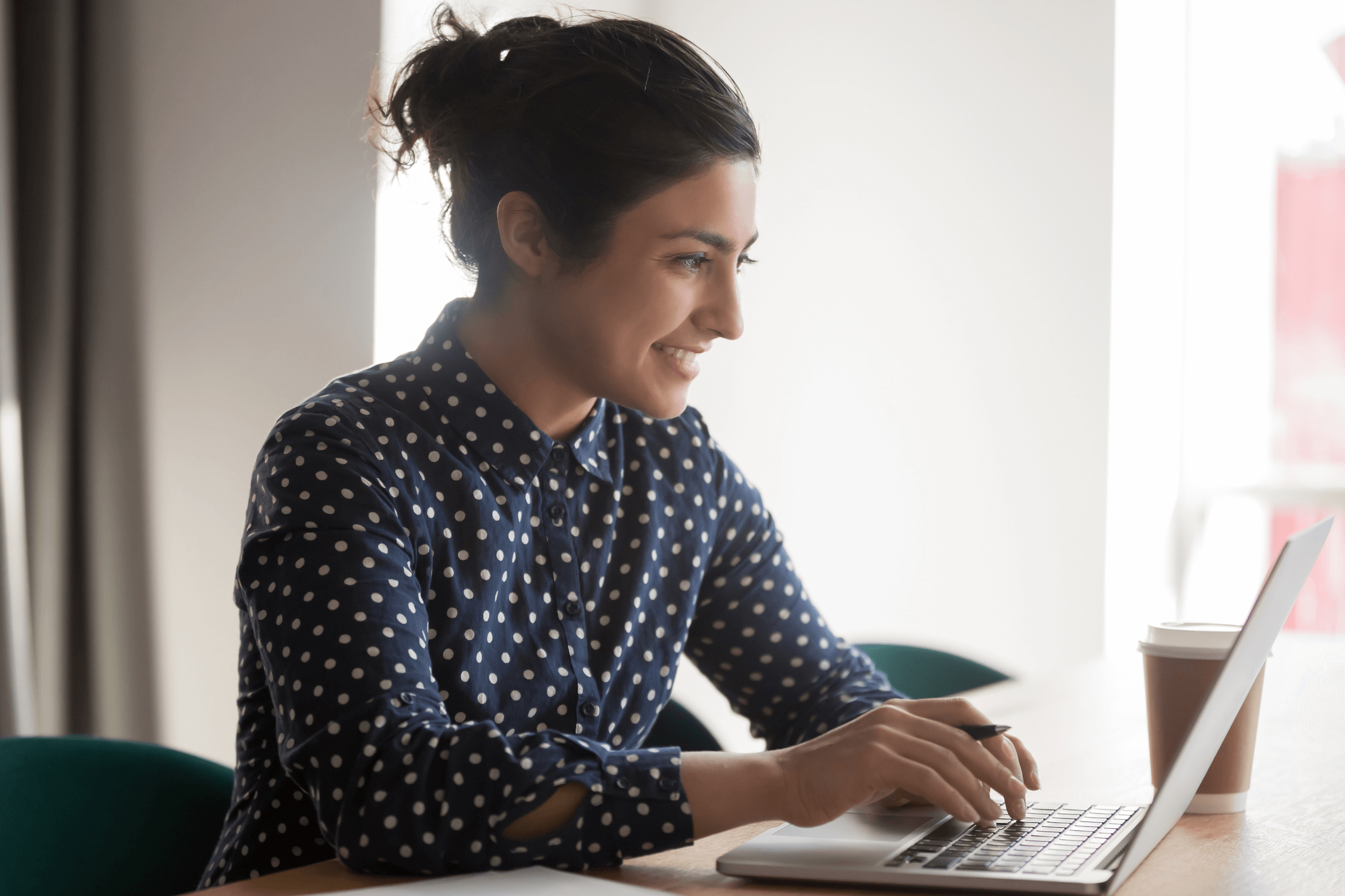 young businessperson smiles while working
