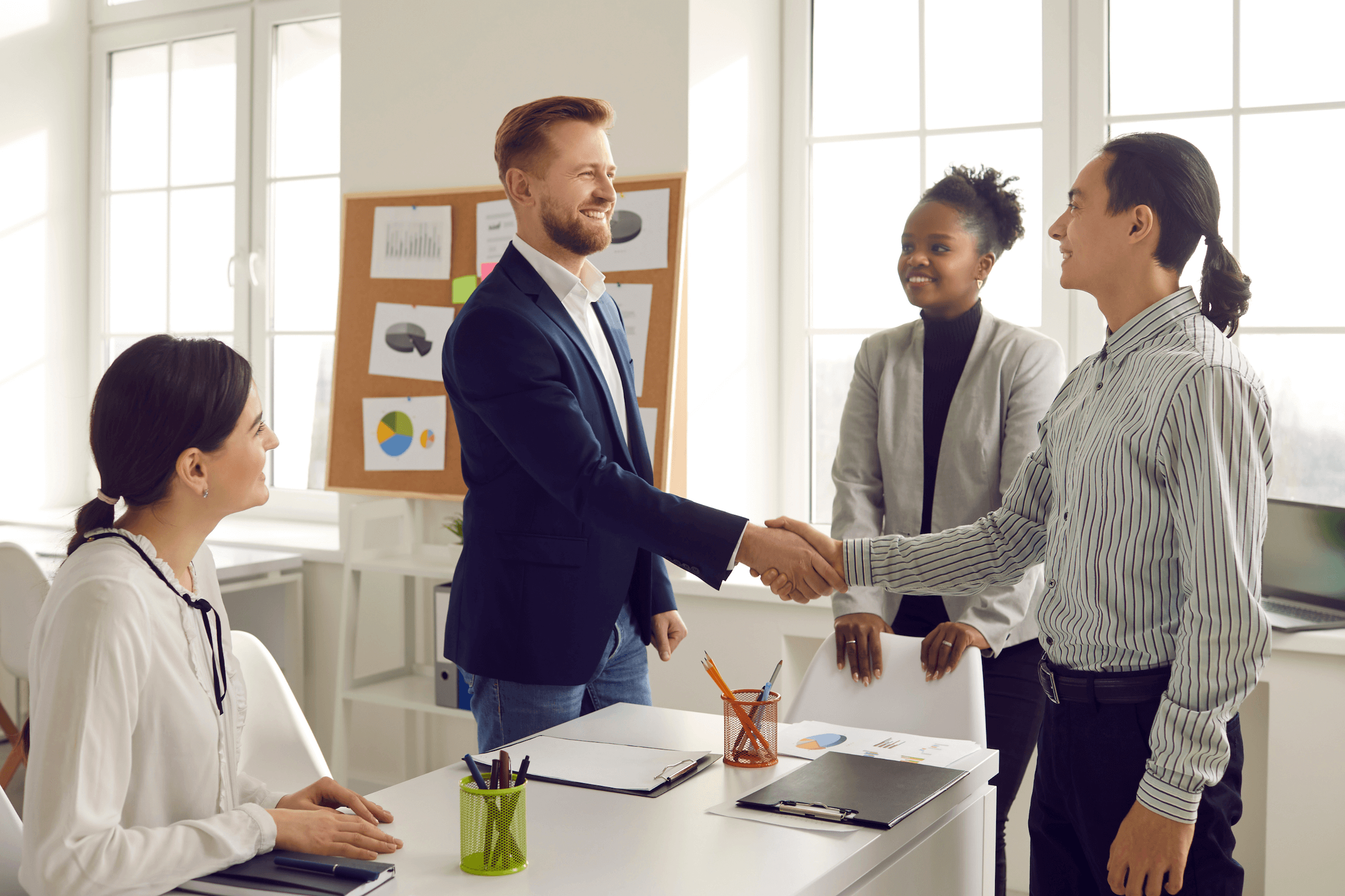 hiring manager shakes job candidates hand