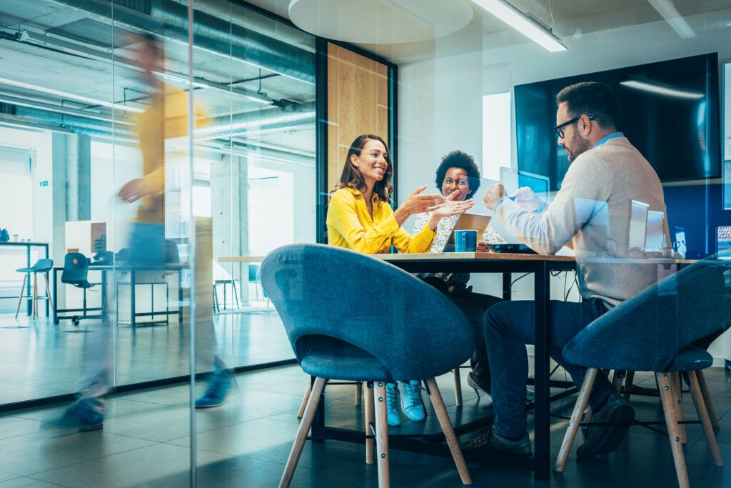 People in office at conference table