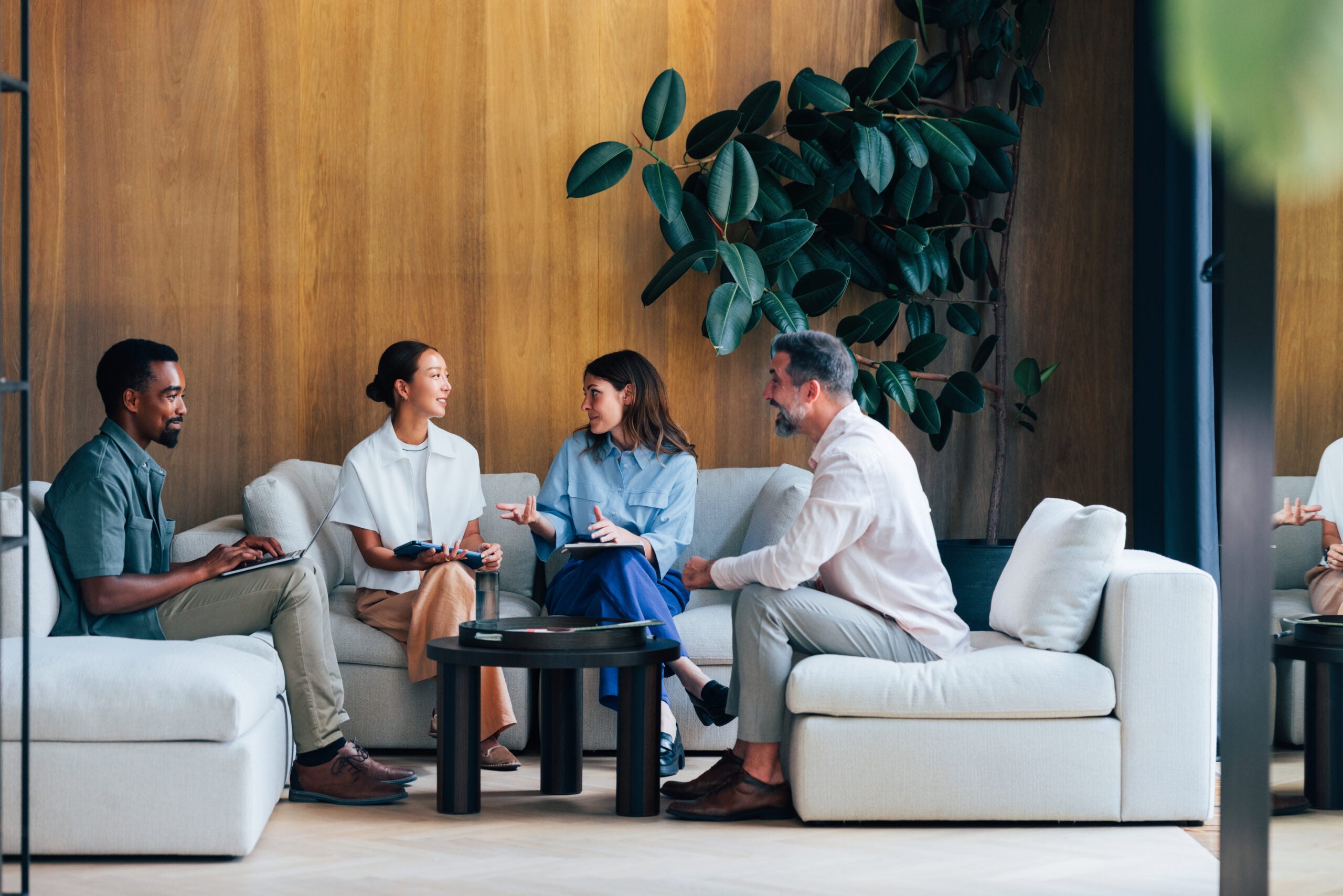 Group of coworkers discussing new hiring strategy.